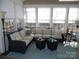 Spacious sunroom with sectional sofa and natural light at 9018 Kestral Ridge Dr, Charlotte, NC 28269