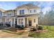 Inviting two-story townhome with stone accents and landscaped yard at 908 Coffee Tree Ln, Rock Hill, SC 29732