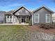 Gray sided home with covered patio and fenced backyard at 9140 Carneros Creek Rd, Charlotte, NC 28214