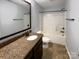 Bathroom with granite countertop, bathtub and toilet at 9140 Carneros Creek Rd, Charlotte, NC 28214