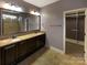 Double vanity bathroom with granite countertops and a walk-in shower at 9140 Carneros Creek Rd, Charlotte, NC 28214