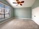 Spacious bedroom with large window and double doors at 9140 Carneros Creek Rd, Charlotte, NC 28214