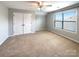 Spacious bedroom with double doors and neutral carpeting at 9140 Carneros Creek Rd, Charlotte, NC 28214