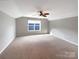 Large bedroom with neutral walls and carpeted floors at 9140 Carneros Creek Rd, Charlotte, NC 28214