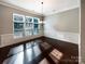 Bright dining room with hardwood floors and elegant wainscoting at 9140 Carneros Creek Rd, Charlotte, NC 28214