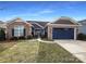 Inviting ranch home with stone accents and a two-car garage at 9140 Carneros Creek Rd, Charlotte, NC 28214