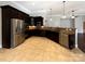 Modern kitchen with dark cabinetry, granite counters, and stainless steel appliances at 9140 Carneros Creek Rd, Charlotte, NC 28214