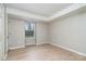 Simple bedroom with laminate flooring and a window at 9325 Old Concord Rd # C, Charlotte, NC 28213