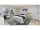 Virtually staged bedroom with a bed and an armchair at 9325 Old Concord Rd # C, Charlotte, NC 28213