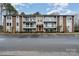 Brick building exterior, featuring balconies and parking at 9325 Old Concord Rd # C, Charlotte, NC 28213