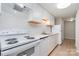 White kitchen with stainless steel appliances and white countertops at 9325 Old Concord Rd # C, Charlotte, NC 28213