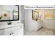 Elegant bathroom with double vanity and large mirror at 1002 Merganser Way, Indian Trail, NC 28079