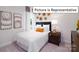 Cozy bedroom with comfortable bed and natural light at 1002 Merganser Way, Indian Trail, NC 28079