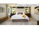 Elegant Primary bedroom with a king-size bed and neutral color palette at 1002 Merganser Way, Indian Trail, NC 28079