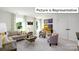 Bright bonus room with sectional sofa and game tables at 1002 Merganser Way, Indian Trail, NC 28079