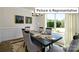 Dining room features a dark wood table and neutral decor at 1002 Merganser Way, Indian Trail, NC 28079