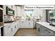 Modern kitchen with white cabinets and herringbone backsplash at 1002 Merganser Way, Indian Trail, NC 28079