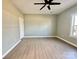 Bright bedroom with wood-look floors and a ceiling fan at 1008 Harrogate Dr, Bessemer City, NC 28016