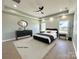 Virtually staged bedroom with a large bed and modern decor at 1008 Harrogate Dr, Bessemer City, NC 28016