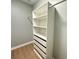 Spacious walk-in closet with built-in shelving and hanging rod at 1008 Harrogate Dr, Bessemer City, NC 28016