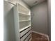 White built-in closet with shelves and drawers at 1008 Harrogate Dr, Bessemer City, NC 28016