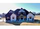 Two-story home with white and black exterior, and landscaping at 1008 Harrogate Dr, Bessemer City, NC 28016