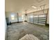 Large garage with concrete floor and two windows at 1008 Harrogate Dr, Bessemer City, NC 28016