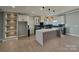 Modern kitchen with white and dark cabinets, large island, and stylish lighting at 1008 Harrogate Dr, Bessemer City, NC 28016