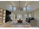 Virtually staged living room with high ceilings, fireplace, and ample natural light at 1008 Harrogate Dr, Bessemer City, NC 28016