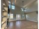 Two-story living room with built-in shelving and fireplace at 1008 Harrogate Dr, Bessemer City, NC 28016
