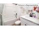 Clean bathroom with bathtub, vanity, and stylish decor at 1023 Merganser Way, Indian Trail, NC 28079
