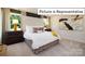 Primary bedroom with a large bed and tufted headboard at 1023 Merganser Way, Indian Trail, NC 28079