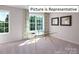 Bright bedroom with large window and built-in desk at 1023 Merganser Way, Indian Trail, NC 28079