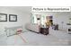 Bonus room features a sectional sofa and game tables at 1023 Merganser Way, Indian Trail, NC 28079