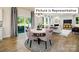 Casual dining area with view of living room and access to the backyard at 1023 Merganser Way, Indian Trail, NC 28079