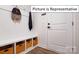 Functional entryway with built-in bench, storage, and hooks at 1023 Merganser Way, Indian Trail, NC 28079