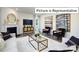 Gathering room with fireplace, comfortable seating and large windows at 1023 Merganser Way, Indian Trail, NC 28079