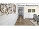 Elegant hallway with wood flooring and decorative wall art at 1023 Merganser Way, Indian Trail, NC 28079