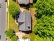 Aerial view of home with mature trees, fenced yard, and driveway showing the home's layout and surroundings at 11006 Knight Castle Dr, Charlotte, NC 28277