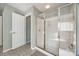 Modern bathroom with a glass-enclosed shower and neutral tones, providing a clean and functional space at 11006 Knight Castle Dr, Charlotte, NC 28277