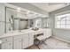 Bright bathroom featuring a large vanity with ample counter space, perfect for organization and comfort at 11006 Knight Castle Dr, Charlotte, NC 28277