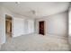 Bedroom with neutral carpet, bookshelf, two closets, and ceiling fan at 11006 Knight Castle Dr, Charlotte, NC 28277