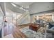 Bright foyer features an open layout, hardwood floors, and a staircase leading to the upper level at 11006 Knight Castle Dr, Charlotte, NC 28277