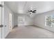 Spacious bonus room with neutral carpet, ceiling fan and abundant natural light at 1102 Dobson Dr, Waxhaw, NC 28173