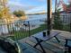 Scenic back porch with lake views, comfortable seating, and an outdoor dining area at 113 Angler Pl, Mooresville, NC 28117