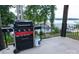 Backyard deck area with gas and charcoal grill offering lake views at 113 Angler Pl, Mooresville, NC 28117