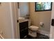 Contemporary half bath featuring a vessel sink, dark vanity, and modern fixtures at 113 Angler Pl, Mooresville, NC 28117