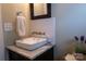Stylish powder room with a vessel sink, granite countertop, and designer faucet at 113 Angler Pl, Mooresville, NC 28117