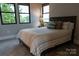 Serene bedroom with large windows offering a view of the trees at 113 Angler Pl, Mooresville, NC 28117