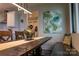 Charming dining room with hardwood table, modern lighting, and cozy bench seating at 113 Angler Pl, Mooresville, NC 28117